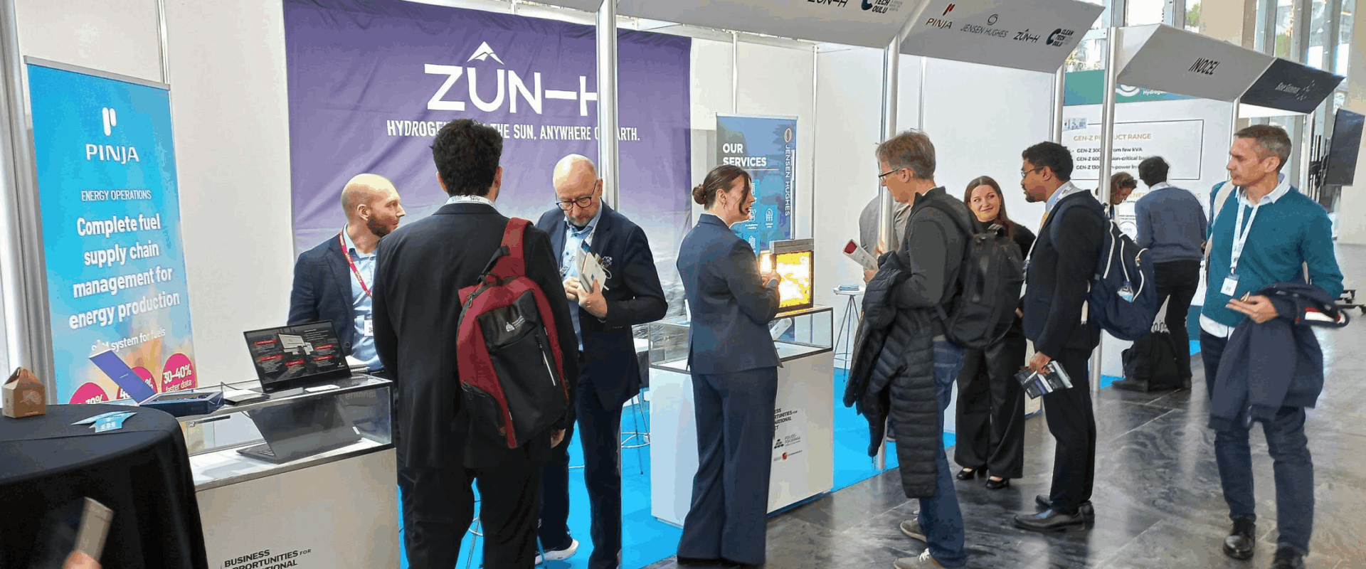 Lots of people in front of the BusinessOulu stand.