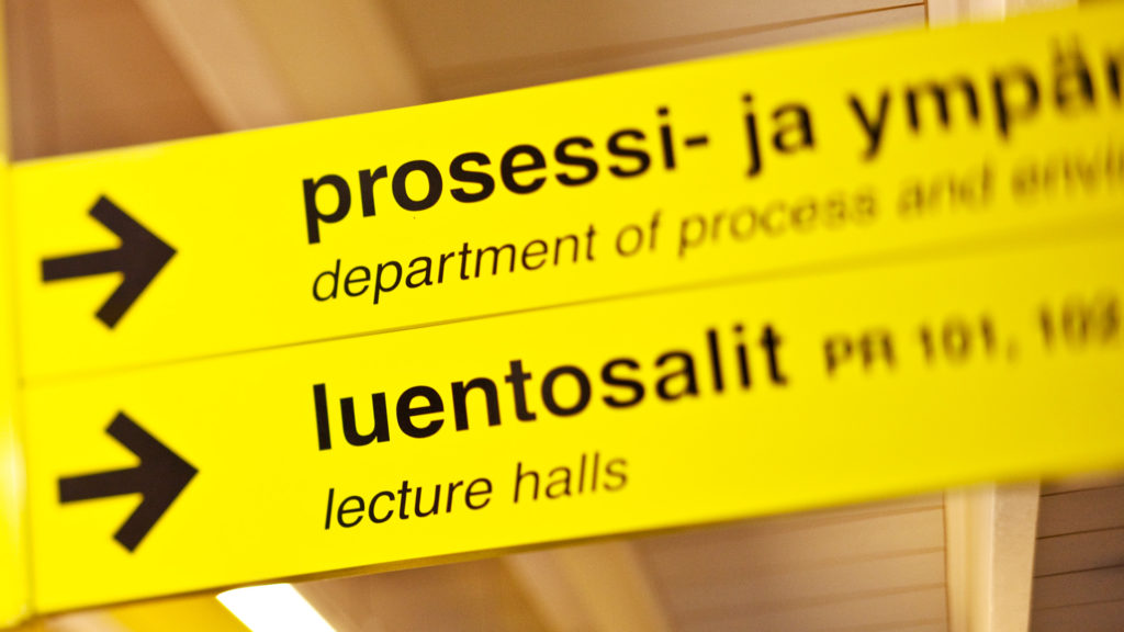 Yellow signposts leading to lecture halls.