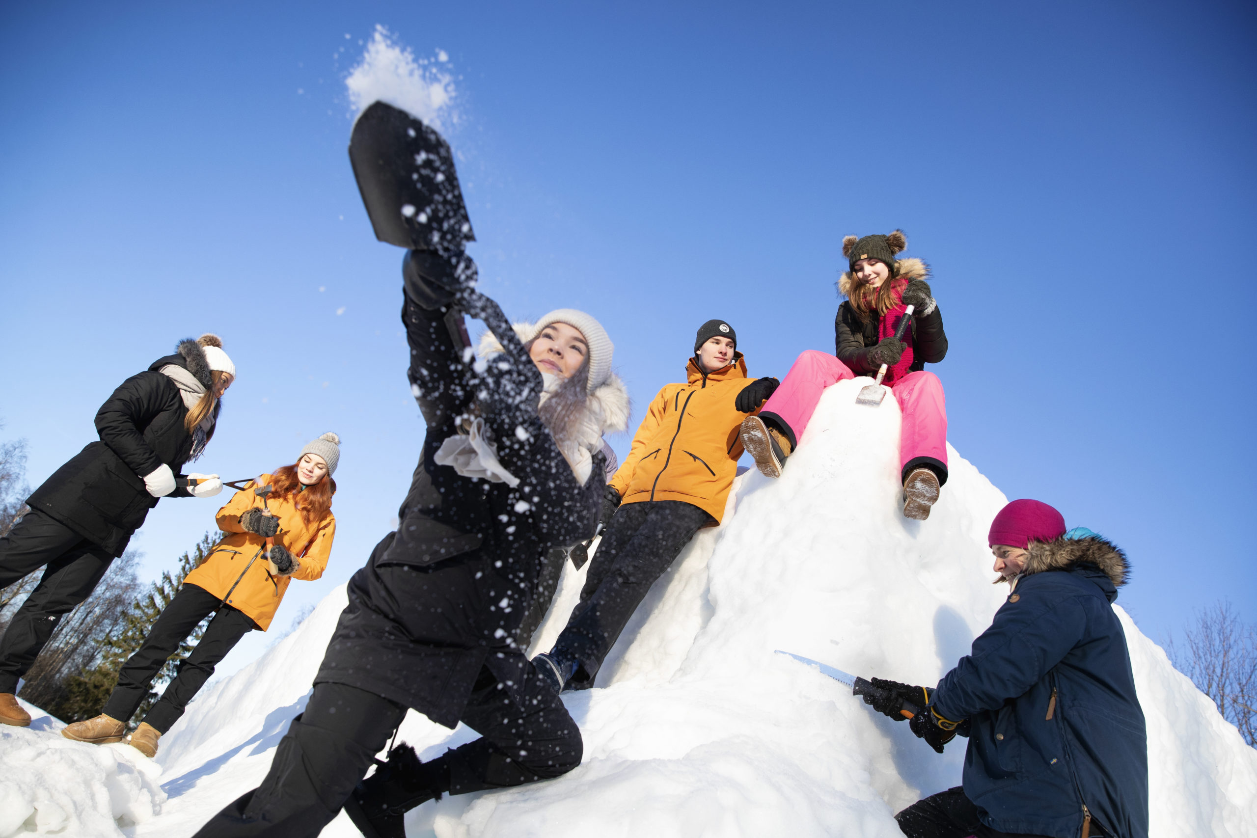 Students playing with snow