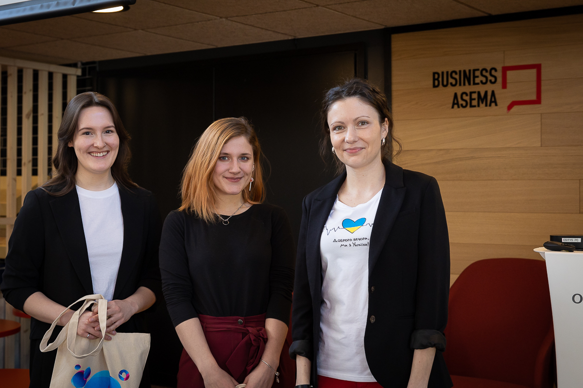 Three woman standing at BusinessAsema