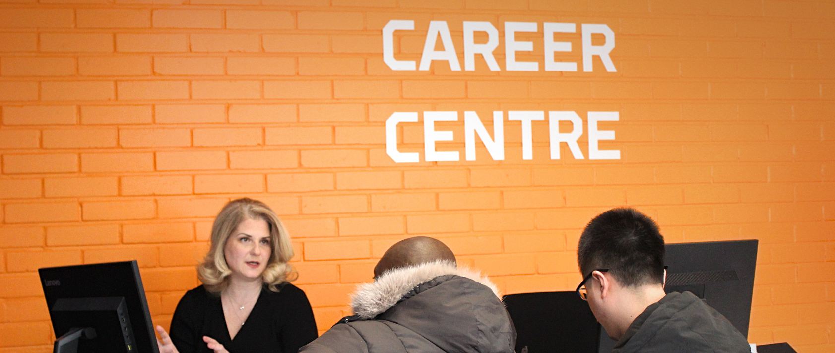 Three persons at the Career center